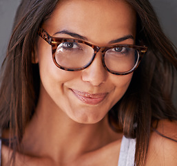 Image showing Woman, face and smile with glasses and eye care, vision with designer frame and prescription lens. Portrait, healthcare and female model with fashion eyewear, eyes with optometry and closeup