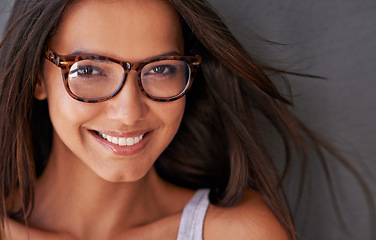 Image showing Woman, face and happy with glasses and eye care, vision with designer frame with prescription lens. Portrait, healthcare and female model with smile and fashion eyewear, optometry and health for eyes