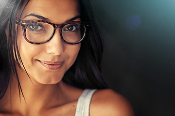 Image showing Woman, face and smile with glasses and vision with designer frame with prescription lens on studio background. Portrait, eye care and female model with fashion eyewear, optometry and mockup space