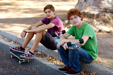 Image showing Happy, skateboarding and portrait of friends in the street for sports, hobby and recreation. Nature, happiness and kids with a skateboard in a park or neighborhood road for skating and weekend fun