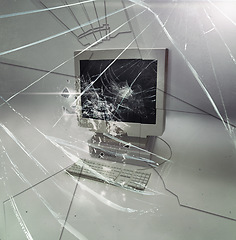 Image showing Crack, glass and isolated desktop computer with problem, destruction and vintage hardware by white background. Retro pc, broken monitor and impact on screen in studio with information technology