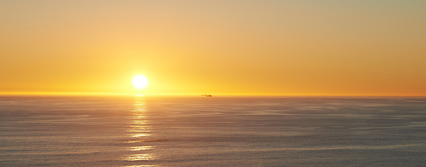 Image showing Sky, sunset and sea at morning on the horizon with ocean and waves landscape. Sunrise background, calm weather and summer by the beach with coastline and outdoor environment with mockup in nature