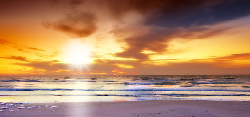 Image showing Sky, sunset and sea at morning on the horizon with ocean and water waves landscape. Sunrise, calm weather and summer by the beach with coastline and outdoor environment with the sun in nature