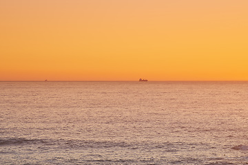 Image showing Sky, sunset and sea at night on the horizon with ocean and waves landscape. Sunrise background, calm weather and summer by the beach with coastline and outdoor environment with mockup in nature