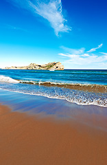 Image showing Ocean, waves with blue sky and landscape, beach and travel, sand and summer vacation outdoor in Hawaii. Environment, horizon and seaside location, tropical destination and journey with mockup space