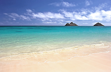 Image showing Island, beach and ocean landscape with clouds in the sky or travel to a tropical nature paradise, dream vacation or holiday, Hawaii, summer wallpaper and relax in water, sun and blue sea waves