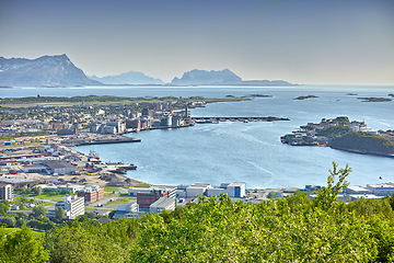 Image showing Aerial, coastline and city by ocean in South Africa for tourism, traveling and global destination. Landscape, background and scenic view of sea by buildings in town for nature, vacation and holiday