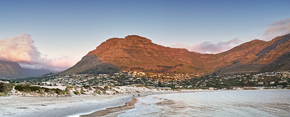 Image showing Mountain, nature and city by ocean in South Africa for tourism, traveling and global destination. Landscape, background and scenic view of beach by urban town for adventure, vacation and holiday