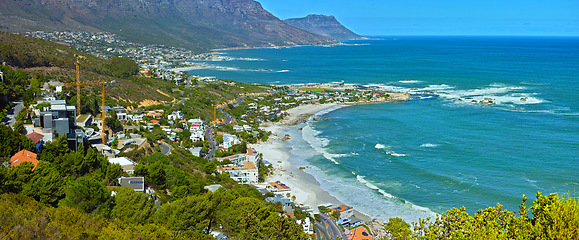 Image showing Mountain, nature and city by beach in South Africa for tourism, traveling and global destination. Landscape, background and scenic view of ocean by urban town for adventure, vacation and holiday