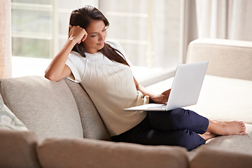 Image showing Laptop, internet and a woman relax at home while streaming movies. Calm female person on lounge couch browsing and reading email, research or social media and online shopping with tech connection