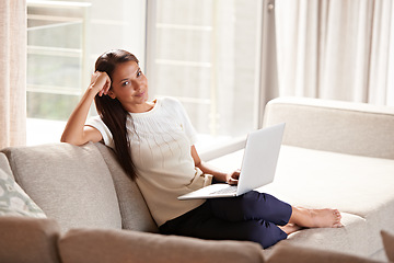 Image showing Laptop, home and portrait of a woman on a sofa with internet connection for streaming online. Happy female person relax on couch with technology for communication, social media and reading email