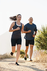 Image showing Mountain, fitness and coach trail running with woman as workout or morning exercise for health and wellness. Sport, man and runner run with athlete as training in nature for sports or energy together