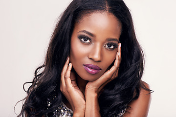 Image showing Makeup, portrait and black woman with hands on face in studio for skincare, hair extension or wig. Female model on a white background for cosmetics, beauty glow and skin luxury or glamour aesthetic