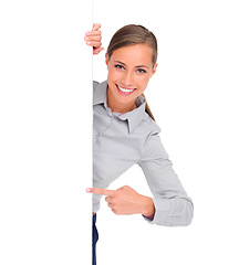 Image showing Pointing, portrait and a woman with a poster for branding isolated on a white background in a studio. Mockup, happy and a brand ambassador with a gesture to signage space for an announcement