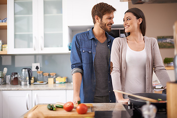 Image showing Love, food and happy couple in kitchen cooking, smile and preparing lunch in their home together. Dinner, date and man with woman for natural nutrition and vegan meal prep in their apartment