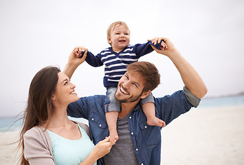 Image showing Airplane, family and baby with parents at a beach for piggyback, fun and walking in nature. Love, kid and happy woman with man outdoors bonding, smile and relax while enjoying travel, freedom or game