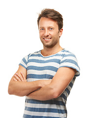 Image showing Crossed arms, fashion and portrait of man on a white background with confidence, happy and pride in studio. Smile, confident and isolated handsome male person with trendy, stylish and casual clothes