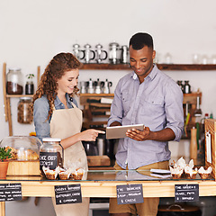 Image showing Employees, man and woman with a tablet, talking and update system with happiness, profit growth or store. Partners, manager or worker with technology, work schedule or collaboration with digital plan