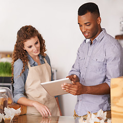 Image showing Tablet, cafe owner and teamwork of people talking, discussion and manage orders. Waiters, black man and woman in restaurant with technology for inventory, stock check and managing sales in store.