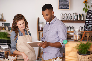 Image showing Tablet, cafe barista and teamwork of people, discussion and training in coffee shop. Waiters, black man and woman in restaurant with technology for inventory, stock check or managing sales in store.