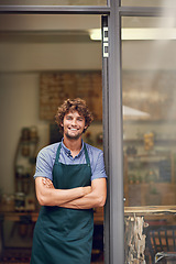 Image showing Management, arms crossed and portrait of man at restaurant as small business owner, coffee shop or waiter. Entrepreneur, happy and smile with professional male barista at front door of cafe and diner