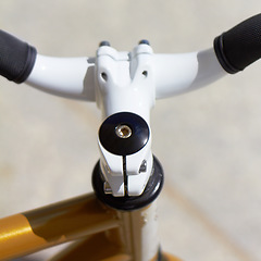 Image showing Fitness, sports and handle with a closeup of a bike outdoor from above for a cycle or ride for cardio training. Exercise, health and a bicycle outdoor for an endurance workout or cycling marathon