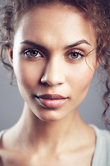 Image showing Beauty, face and portrait of woman in studio confident, beautiful and gorgeous on gray background. Salon, attractive and closeup of female person with natural makeup, cosmetics and curly hairstyle