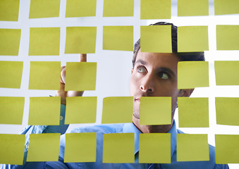 Image showing Creative man, face and thinking, pointing to sticky note in schedule brainstorming or planning tasks on glass board. Thoughtful male contemplating business startup or strategy in wonder at the office
