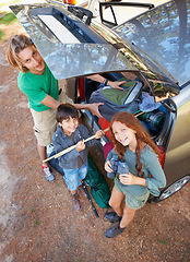 Image showing Happy family, portrait and road trip above packing car for camping, holiday or vacation together in nature. Top view of dad and kids getting ready for travel, summer camp or adventure in the forest