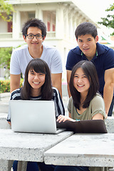 Image showing Smile, portrait and students with a laptop for education, studying and college research. Happy, Asian and men and women with a computer and notes for university work, learning and a group project