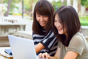 Image showing Laptop, university and female students studying outdoor on campus for a test, exam or assignment. Happy, smile and women doing research or browsing for education information on a computer at college.