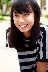 Image showing Portrait, education and Asian woman on campus, laptop and social media with connection, project and email. Face, female person and student with a pc, knowledge and typing with website information