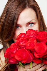 Image showing Roses, flowers and portrait of woman with red gift for love, celebrate and a valentines day floral present or glamour. Aesthetic, skincare and eyes of female person or model with plants or a bouquet