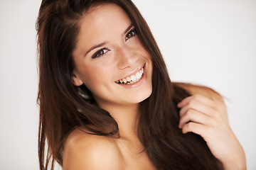 Image showing Portrait, skincare and smile with a model woman in studio on a white background for natural beauty. Face, happy and cosmetics with an attractive young female person posing for luxury skin wellness