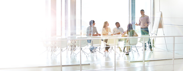 Image showing Data review, colleagues and chart in a business meeting of their modern workstation with a lens flare. Teamwork or collaboration, planning or brainstorming and people working together in a boardroom