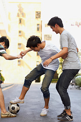 Image showing Friends in city street playing soccer together for sports, fun and happy energy with urban games in Korea. Ball game for teen friendship, group of people in road with football, weekend in community.