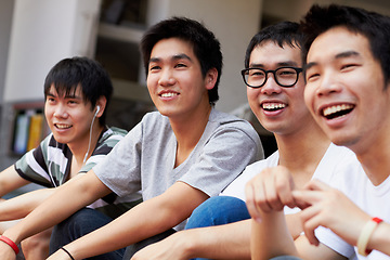 Image showing Happy, relax and men together on the weekend for happiness, friendship and bonding. Smile, teenager and Asian friends laughing, talking and having fun while watching a soccer game or competition