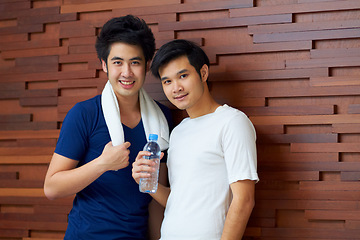 Image showing Happy, portrait and gay couple at the gym with water on a break from a workout together. Smile, wellness and Asian lgbt men training at a club for exercise, health and happiness with fitness