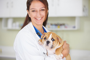 Image showing Woman vet, puppy and hospital portrait with smile, care and love for health, wellness or growth. Female veterinarian, doctor and dog with hug, happiness and healthcare in clinic for medical attention