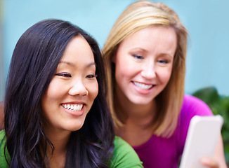 Image showing Phone, app and women on social media, internet and share meme in an outdoor park together chatting on a mobile. Technology, happy and young people or friends search the web, website on a smartphone