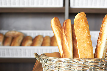 Image showing Bakery, bread basket and a supermarket or grocery store for a diet or healthy food with nutrition on a shelf. Morning, kitchen and oven baked fresh roll or product for lunch or breakfast in a shop