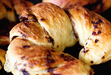 Image showing Chocolate croissant, food and bakery cooking for catering service, breakfast or baked meal at cafe. Closeup of fresh or crispy bread or dessert for eating, sweet cake or nutrition roll in the kitchen