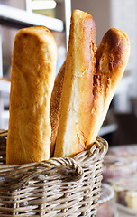 Image showing Wheat bakery with bread basket in a supermarket or grocery store for a diet or healthy food with nutrition. Morning, kitchen and oven baked fresh roll or product for lunch or breakfast in a shop