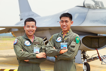 Image showing Portrait of men, fighter pilot team in military with jet and smile at airforce base with arms crossed in Korea. Freedom, transport and proud Asian soldier with airplane, confident and service in army