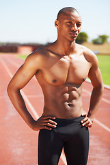 Image showing Body, mindset and topless man at a race track for training, fitness and sport, cardio and speed running practice. Stadium, start and African male runner serious, focus and ready for performance run