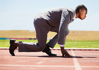 Image showing Business, start and black man with focus, race track and competition with determination, run and goal. Male person, entrepreneur or employee in a suit, marathon and runner with a challenge and career