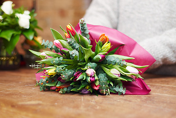 Image showing Closeup, bouquet and florist with startup, flowers and prepare gift for a customer, client and growth. Zoom, female person and entrepreneur with plants, present and floral arrangement with employee