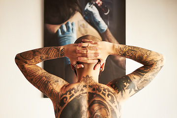 Image showing Man, tattoo and back or art with body with creativity or unique or shirtless at house. Tattoos, male person and backwards with ink with hands on head with skin for aesthetic or creative or edgy.