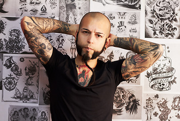 Image showing Portrait, tattoo and man with creativity, artist and business with skills, wallpaper and design. Face, male person and guy with creative, ink and career with body art, trendy and edgy with culture