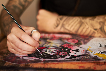 Image showing Art, paint and creative with a woman tattoo artist closeup in a studio to design a piece of artwork. Hand, canvas and a female painter using color ink while painting a picture closeup for expression